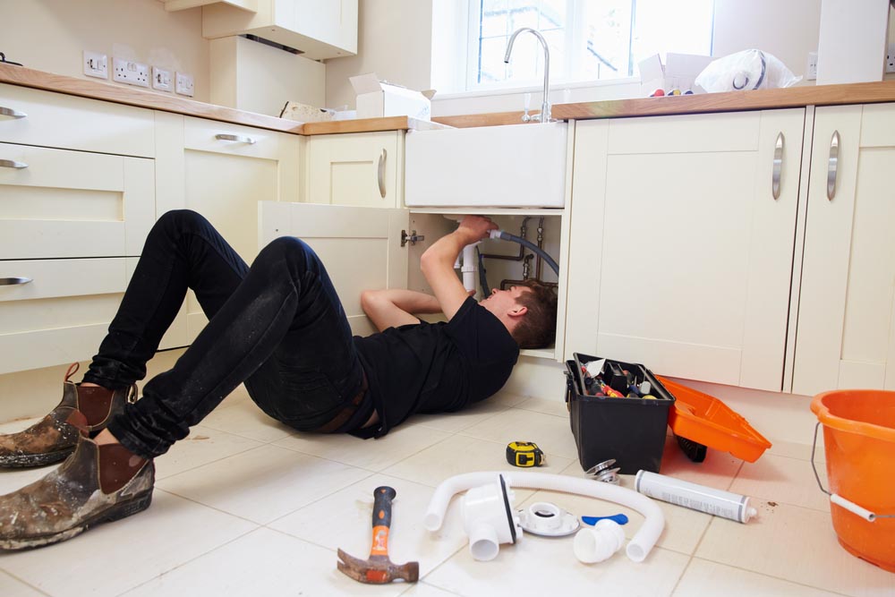 Plumber under sink