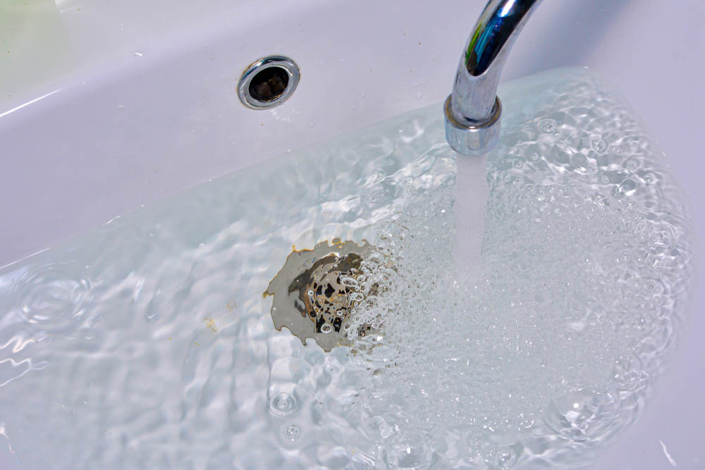 Water drains into a hole in the sink Charlottesville, VA