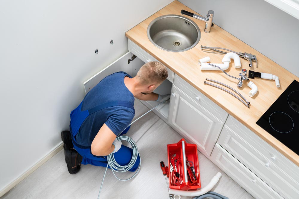 Drain cleaning sink