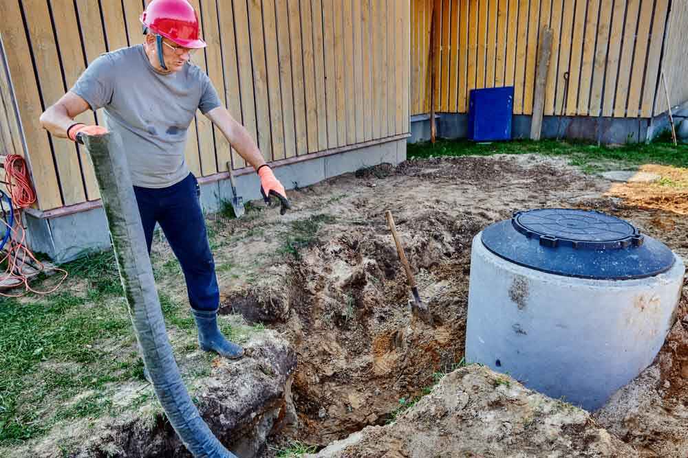 Speedy Rooter technician working on drain field rehabilitation Speedy Rooter technician working on drain field rehabilitation