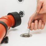 homeowner snaking a sink