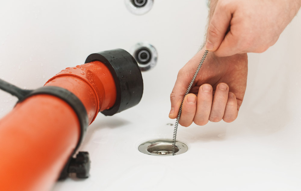homeowner snaking a sink homeowner snaking a sink