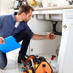 Speedy Rooter technician performing a plumbing inspection