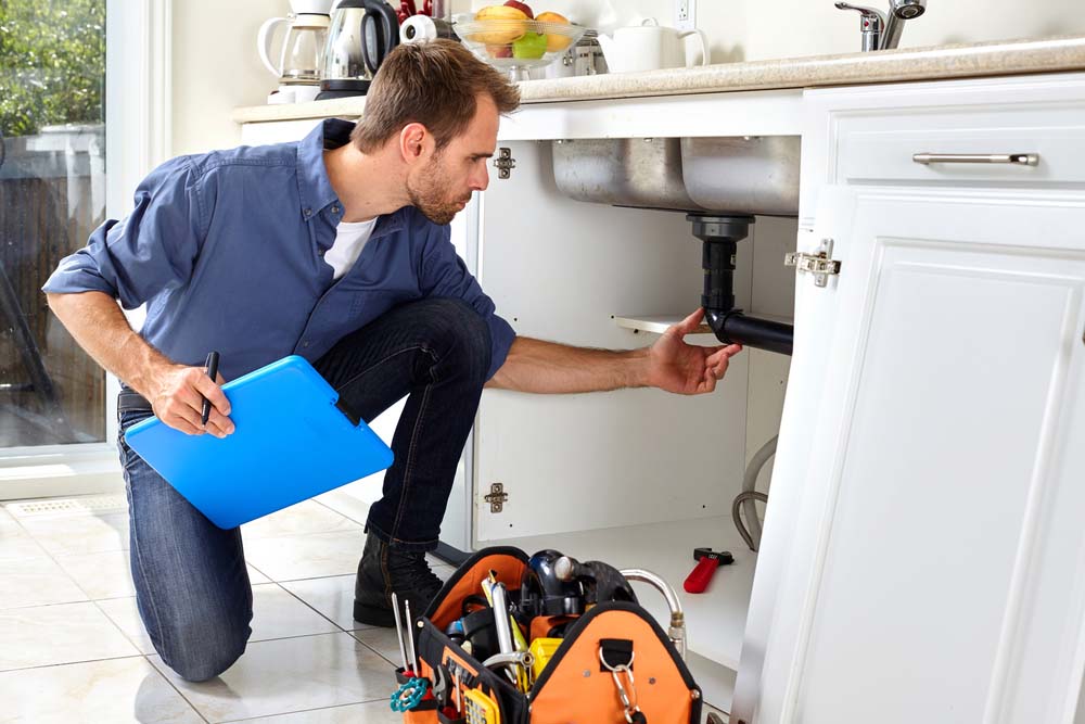 Speedy Rooter technician performing a plumbing inspection Speedy Rooter technician performing a plumbing inspection