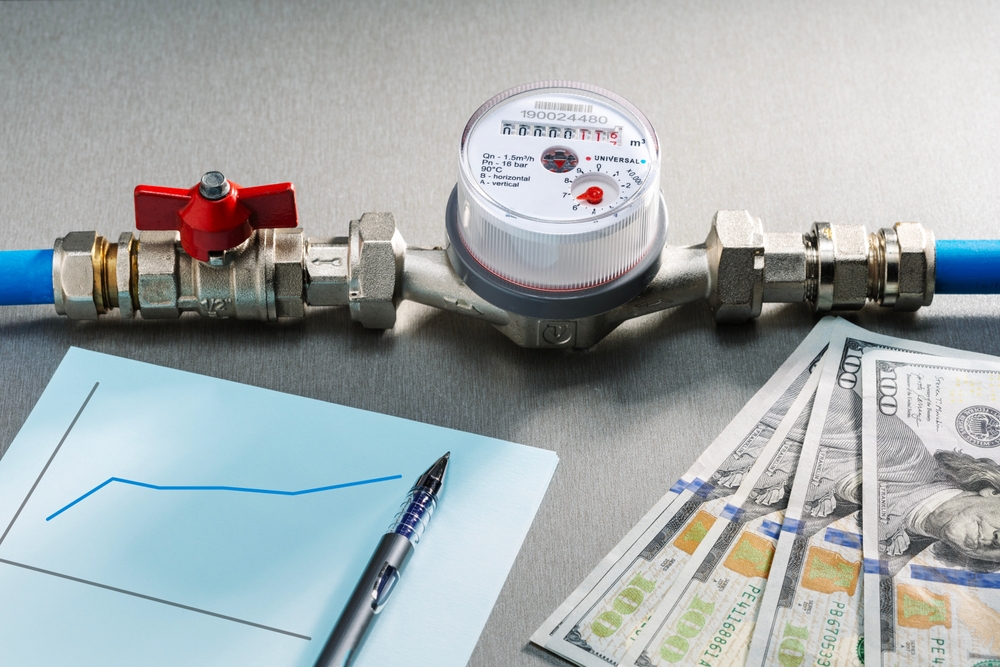 Water meter and us dollars money currency banknotes